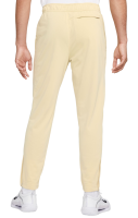 Muške trenirke Nike Court Heritage Suit Pant - team gold Muške trenirke Nike Court Heritage Suit Pant - team gold
