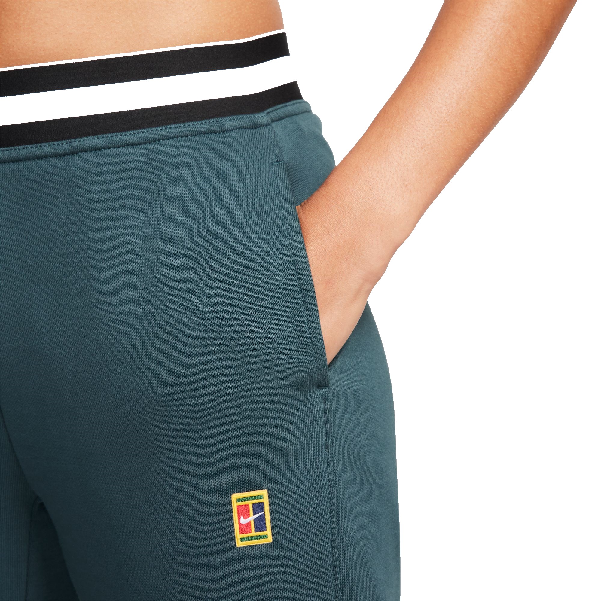Women's trousers Nike Dri-Fit Heritage Core Fleece Pant - deep jungle, Tennis Zone