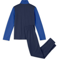 Tepláková souprava pro mladé Nike U Swoosh Futura Poly Cuff TS - Modrý Tepláková souprava pro mladé Nike U Swoosh Futura Poly Cuff TS - Modrý