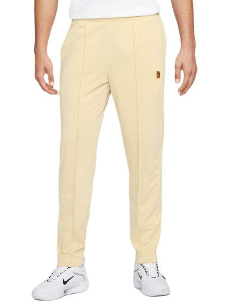 Pantaloni da tennis da uomo Nike Court Heritage Suit Pant - team gold
