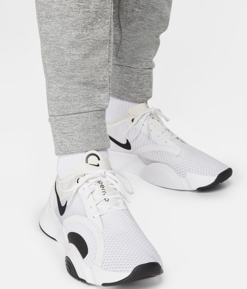 NIKE Nike THERMA FIT - Pantaloni tuta Bambino carbon heather/lt smoke grey  - Private Sport Shop